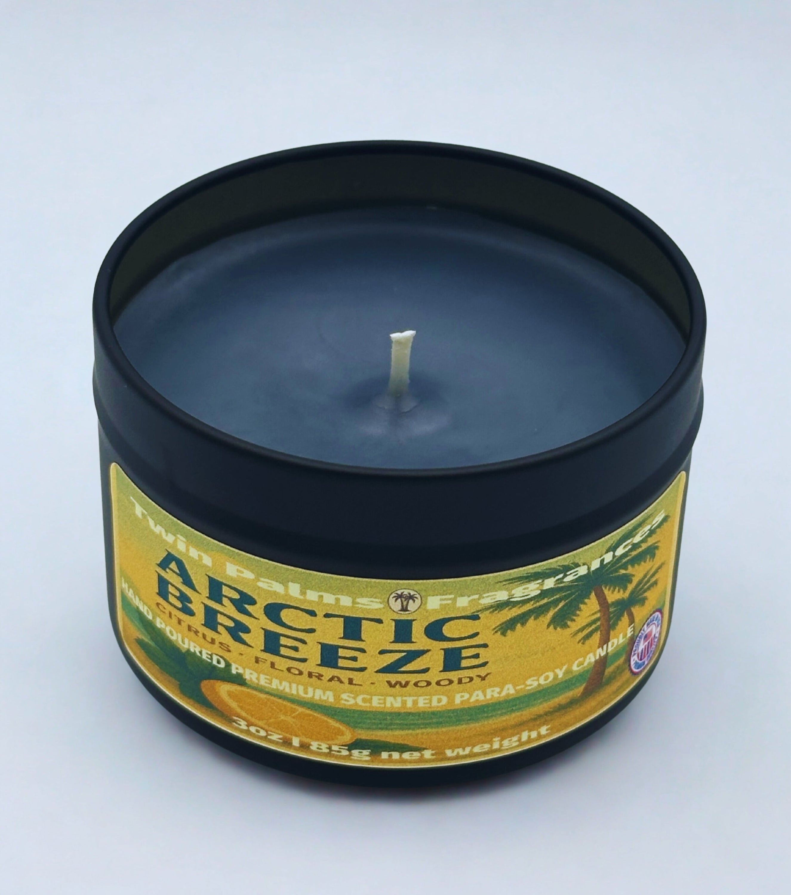 Twin Palms Fragrances Candle in a tin labeled arctic Breeze on a white background