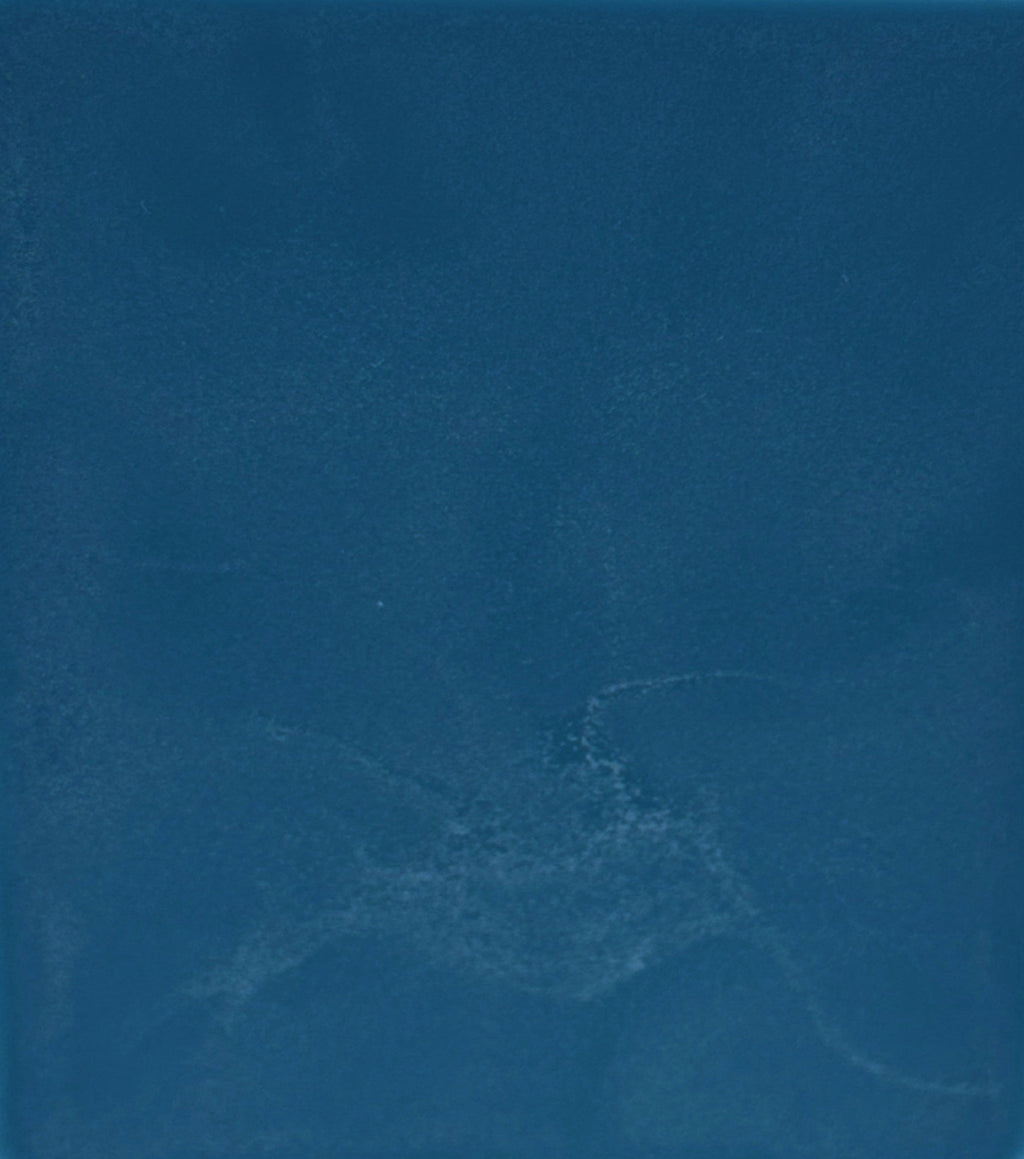 Solid blue color swatch with a subtle texture