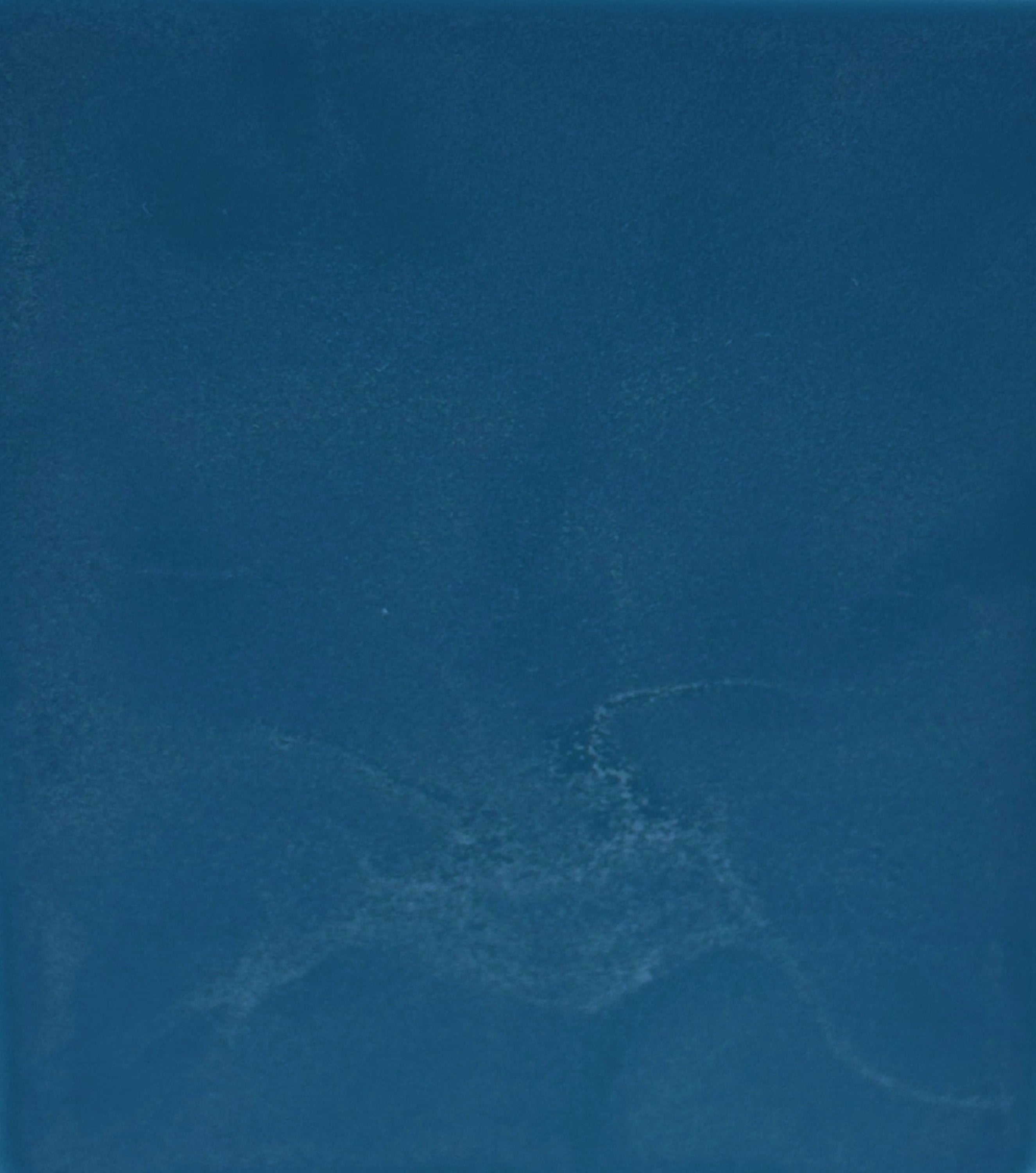 Solid blue color swatch with a subtle texture