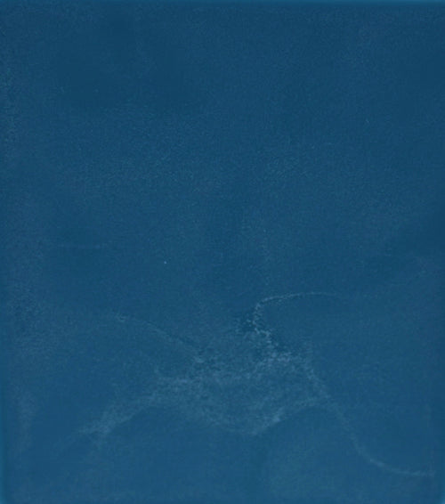 Solid blue color swatch with a subtle texture