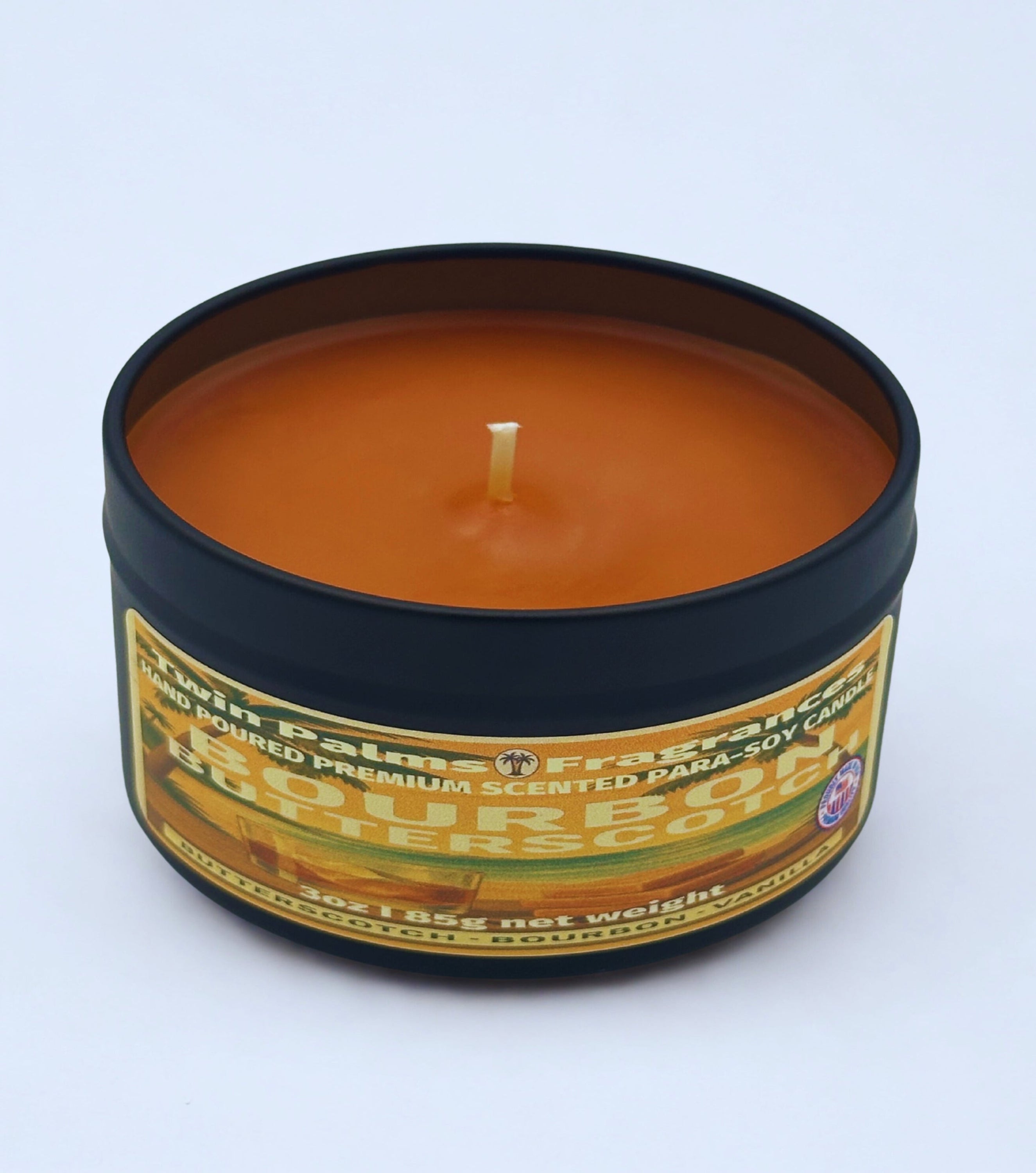 Twin Palms Fragrances Bourbon Butterscotch Candle in a tin with a label on a white background