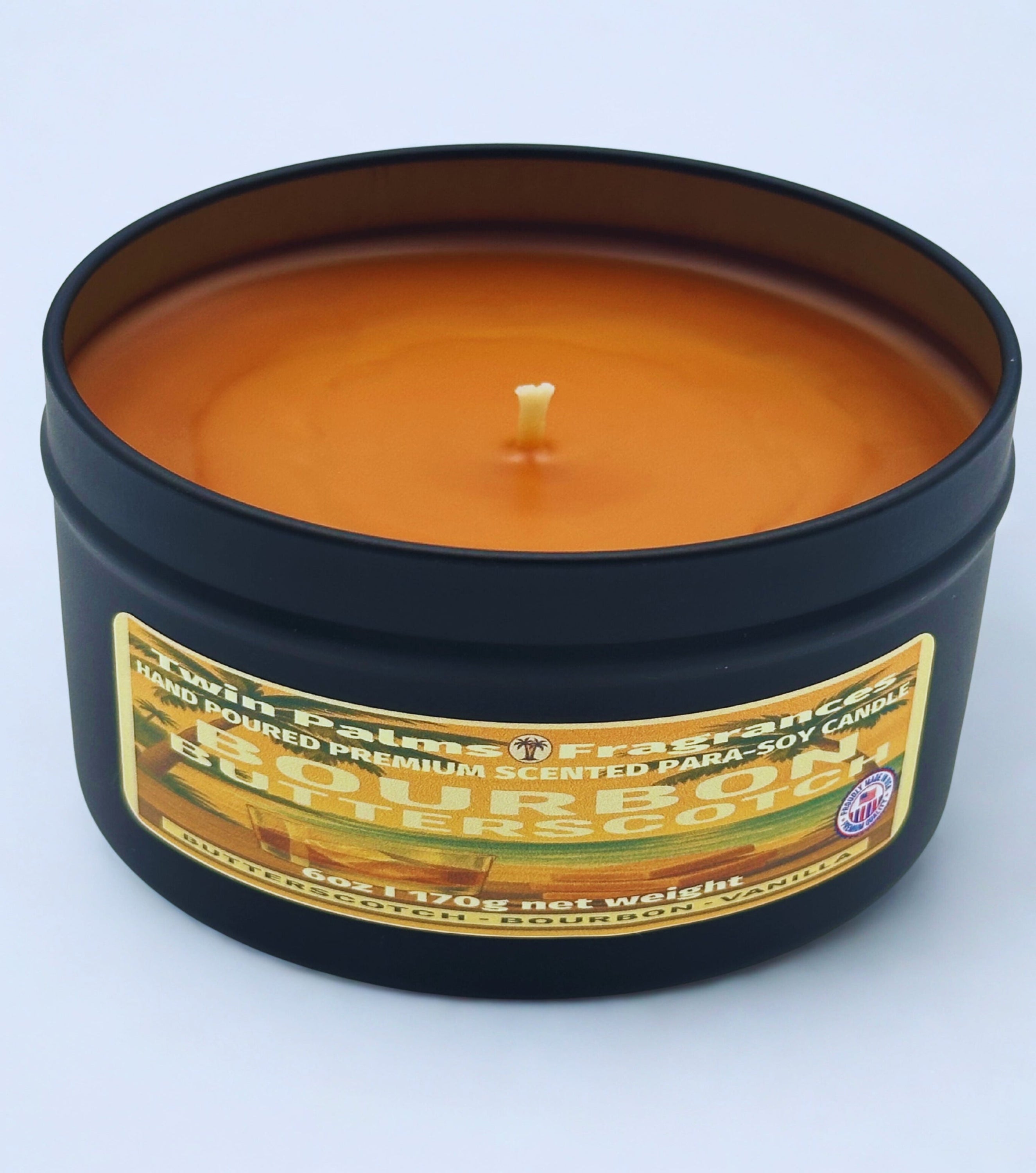 Bourbon Butterscotch Scented candle in a tin with a label on a white background