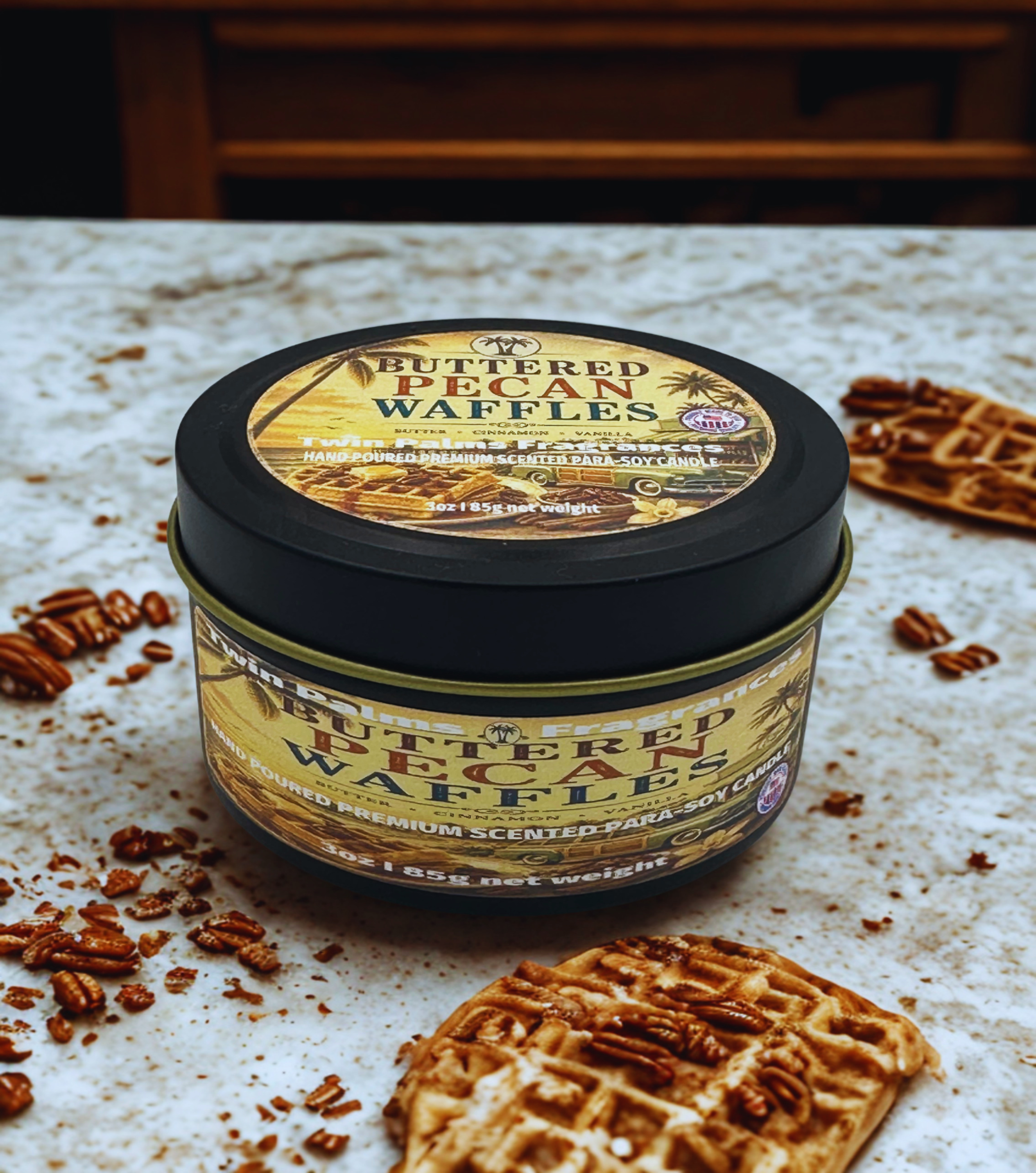Tin of 'Buttered Pecan Waffles' candles on a textured surface with waffle cookies.