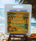 Twin Palms Fragrances Citrus Coconut Sunshine wax melt packaging on a beach background