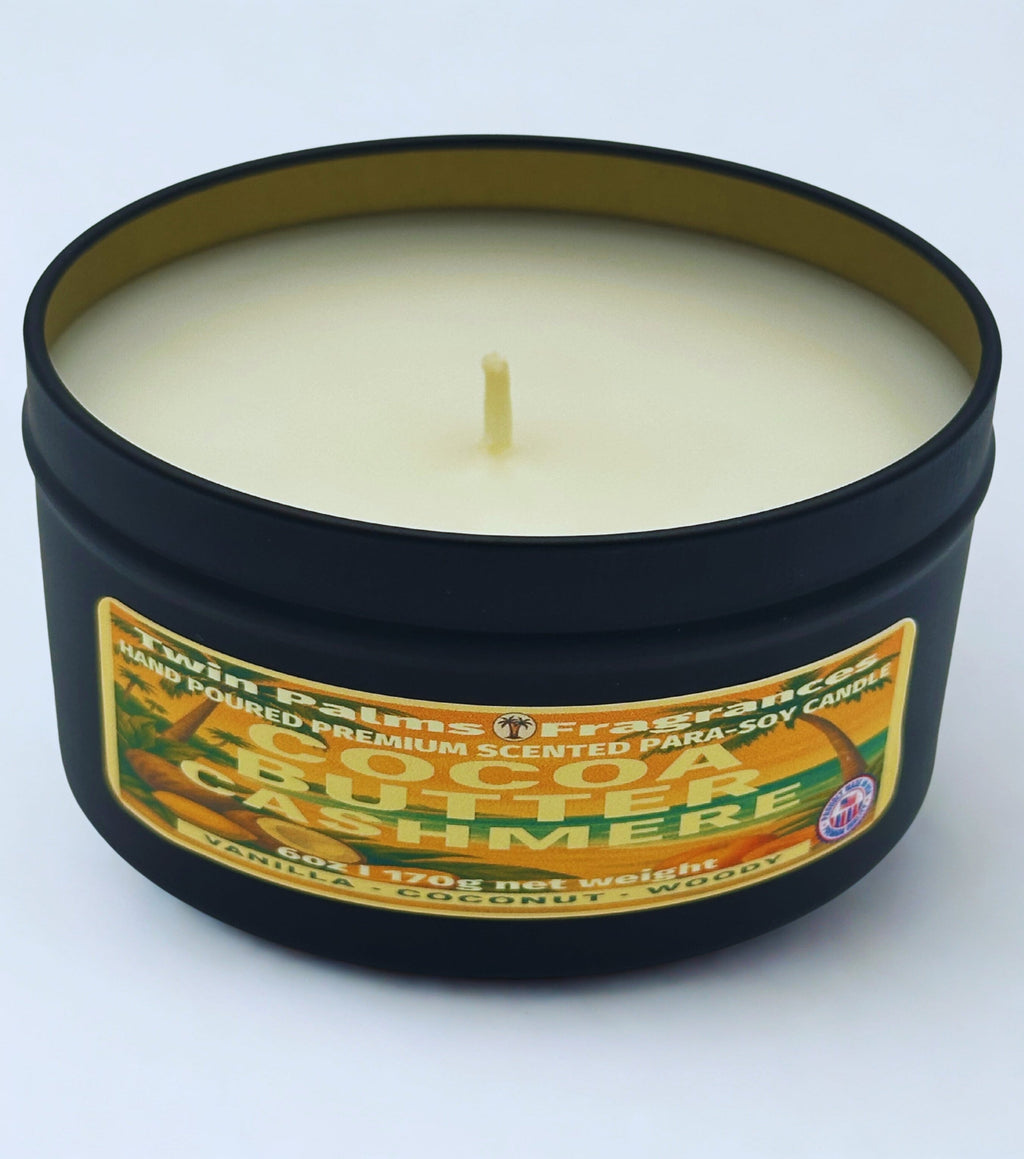 Twin Palms Fragrances Cocoa Butter Cashmere Candle in a black tin with a label on a white background