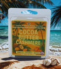 Twin Palms Fragrances cocoa butter cashmere wax melts packaging with a beach background