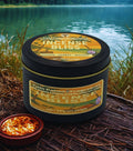 Twin Palms Fragrances Incense Bliss candle tin with a lit incense stick on a natural background