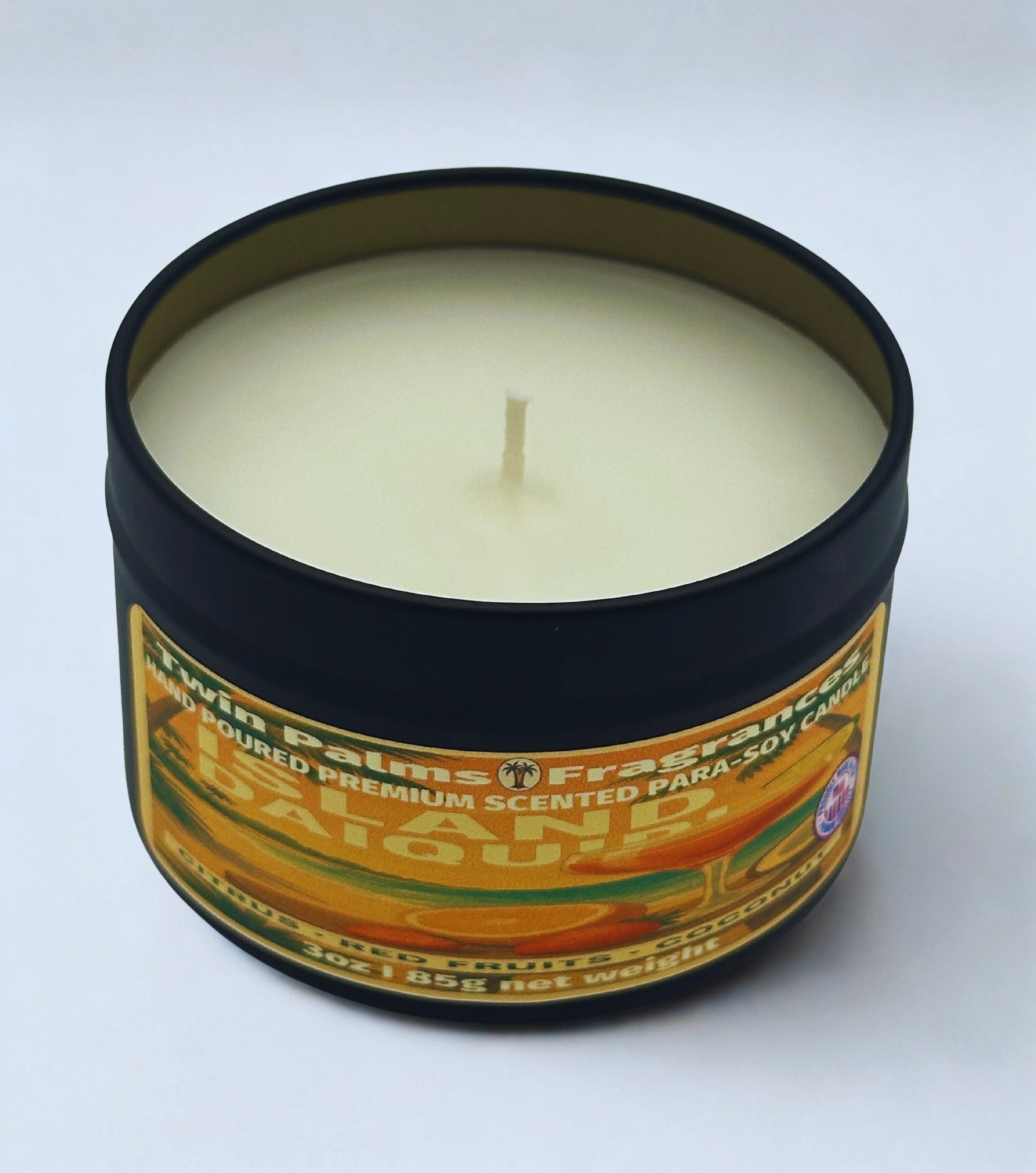 Island Daiquiri Candle in a tin container with a label on a white background