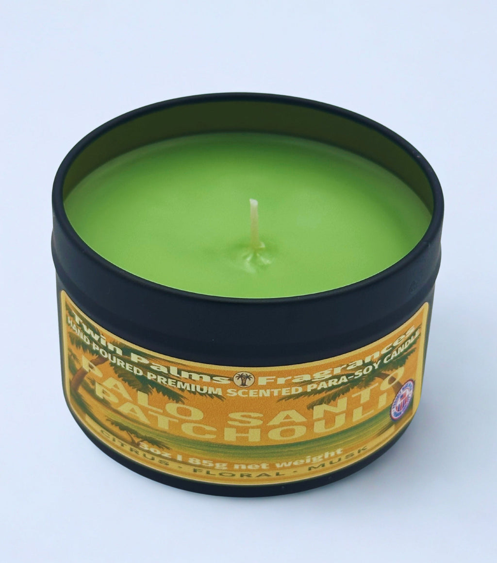Twin Palms Fragrances green candle in a tin labeled 'Palo Santo Patchouli' on a white background