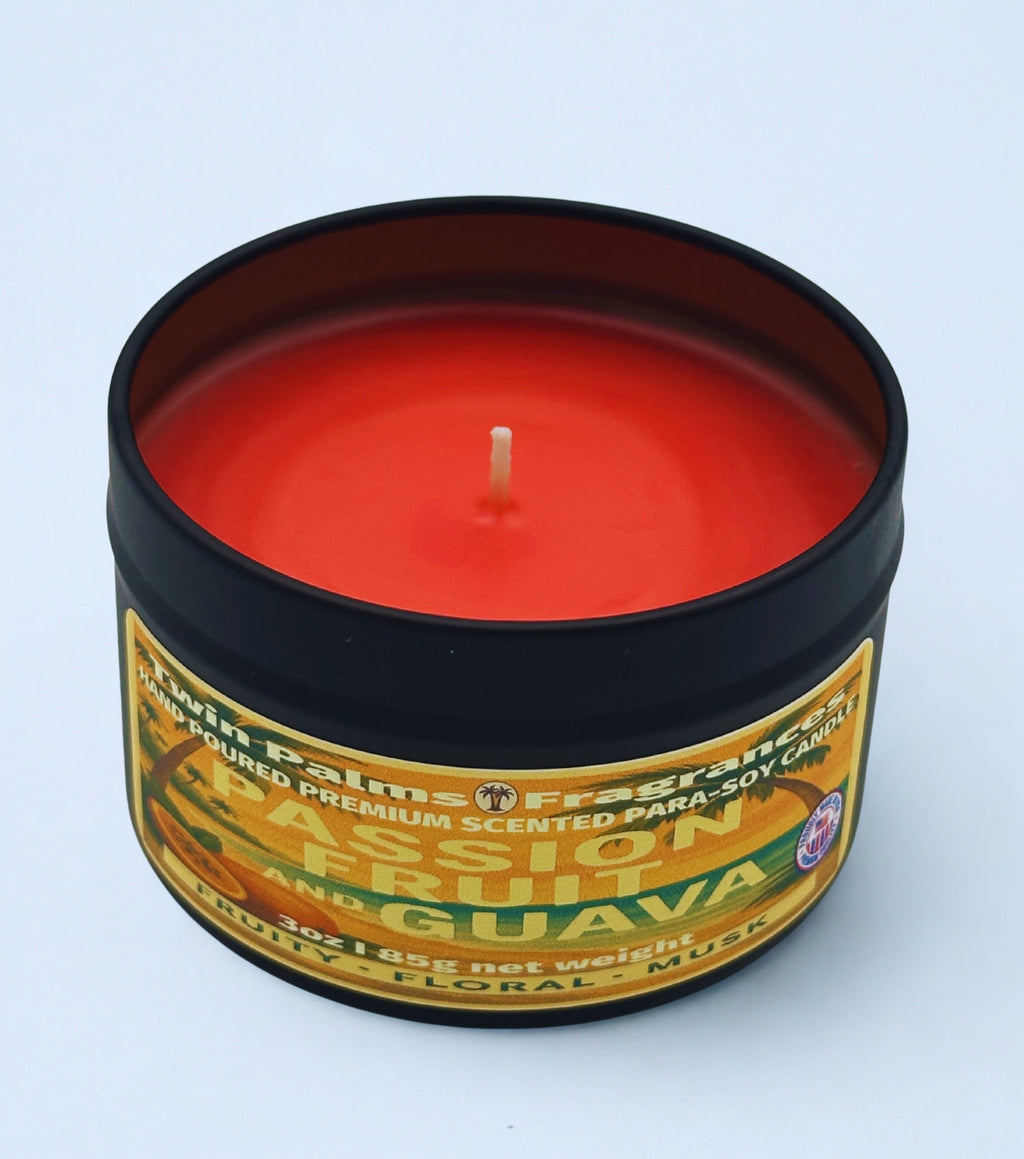 Twin Palms Fragrances candle Passion Fruit and Guava in a tin container with a label on a light blue background