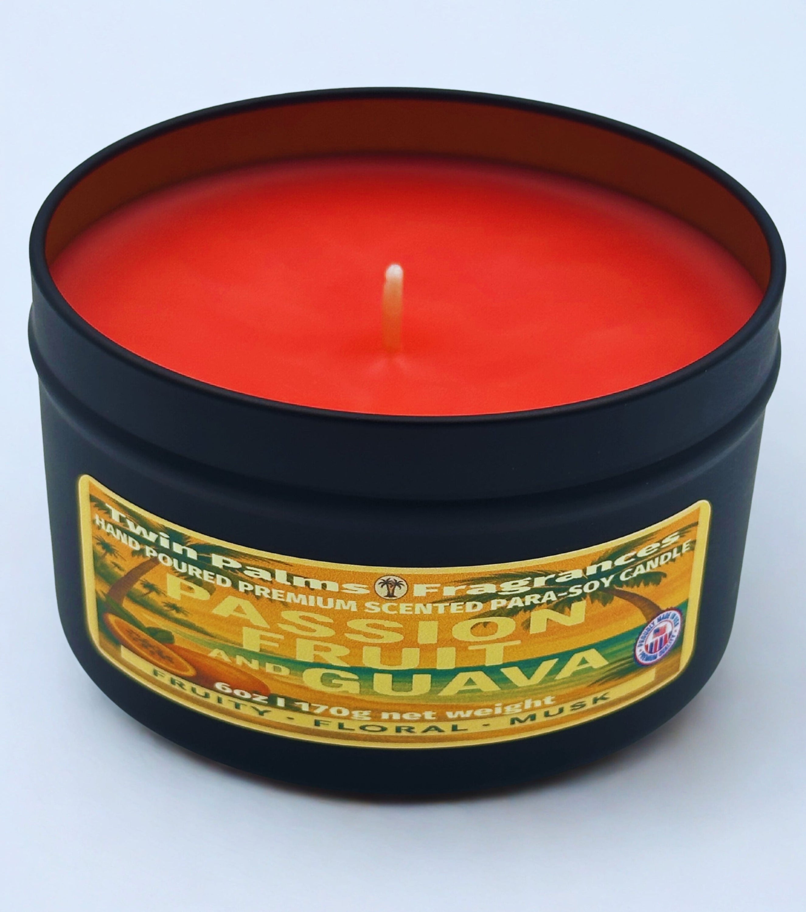 Twin Palms Fragrances candle in a tin with 'Passion Fruit and Guava' label on a white background