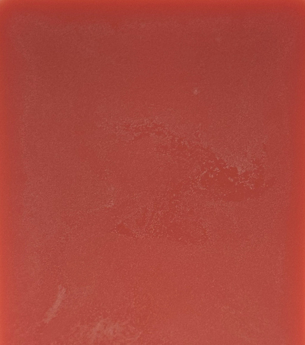 Solid red color swatch with a textured surface