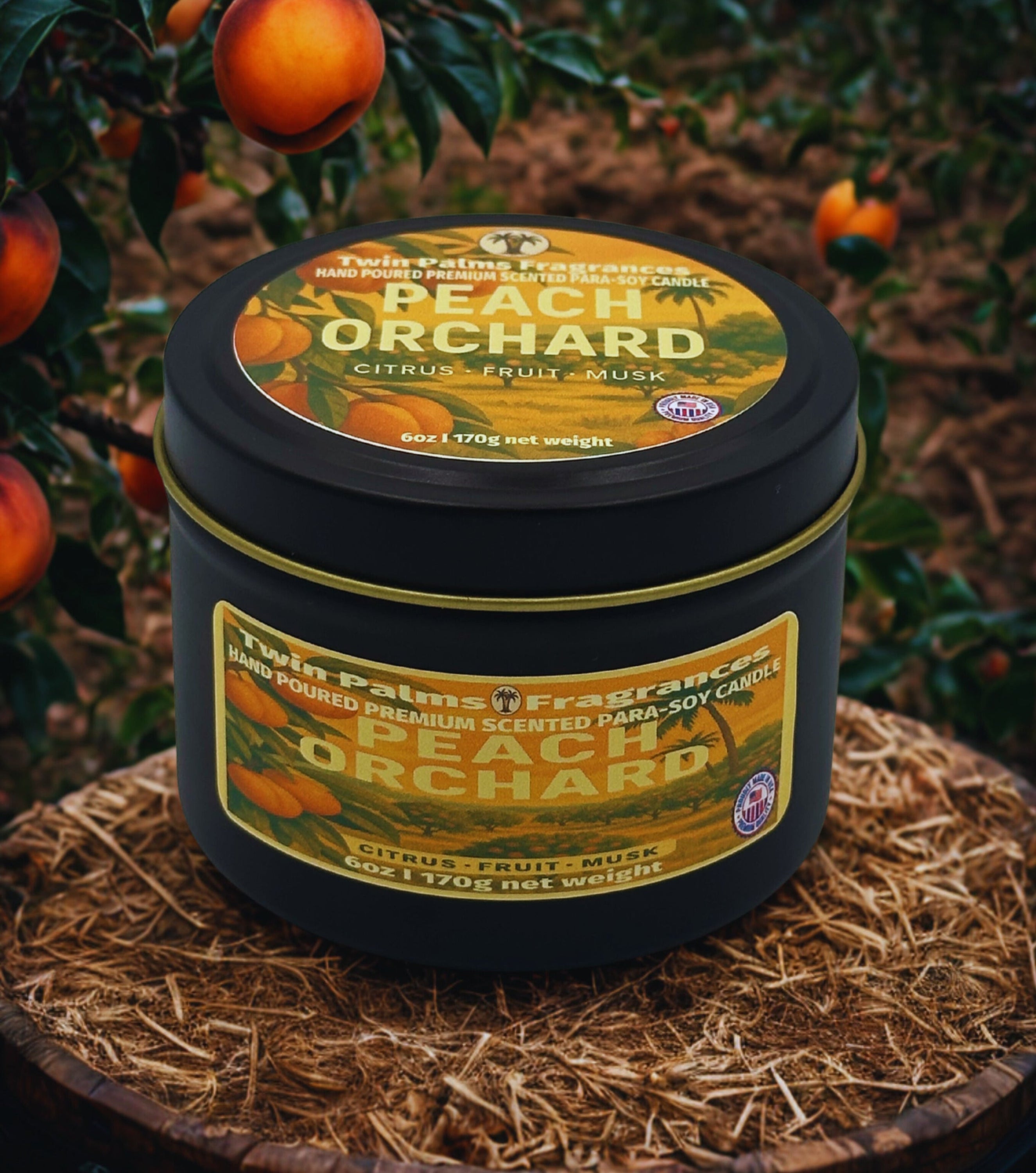 Candle labeled 'Peach Orchard' by Twin Palms Fragrances on a wooden surface with peach tree in the background.