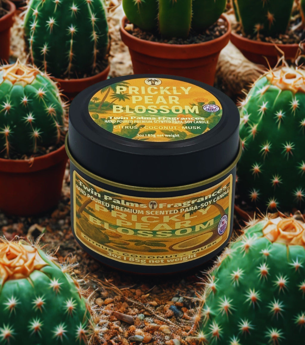 Twin Palms Fragrances candle labeled 'Prickly Pear Blossom' surrounded by cacti