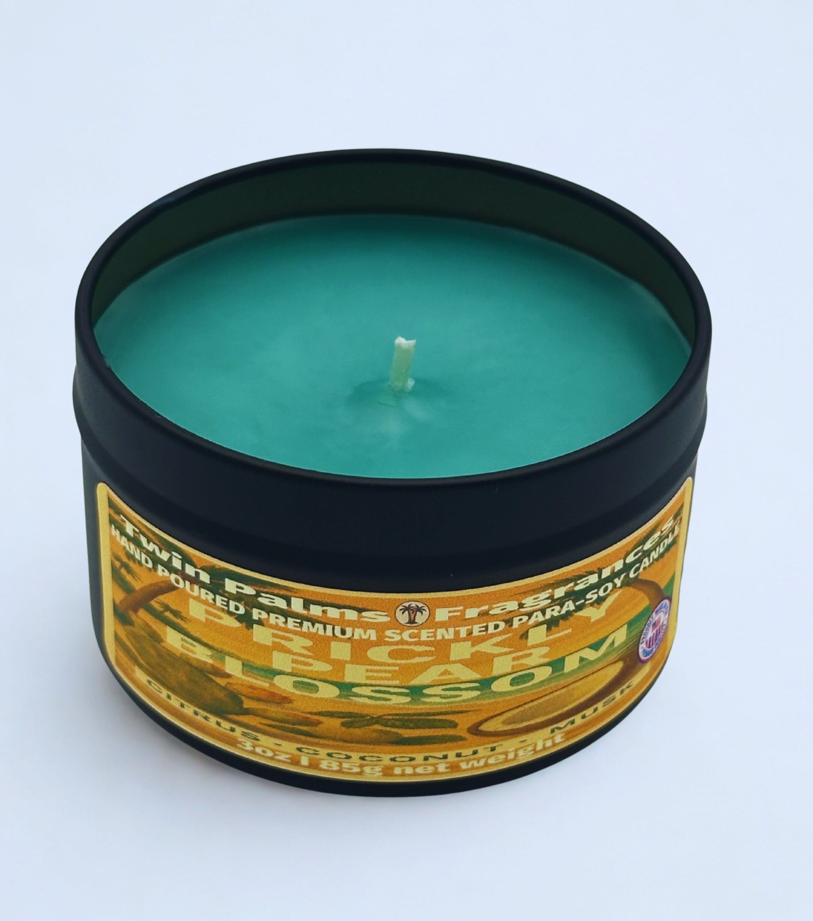Twin Palms Fragrances candle Prickly Pear Blossom  in a tin with a label on a white background