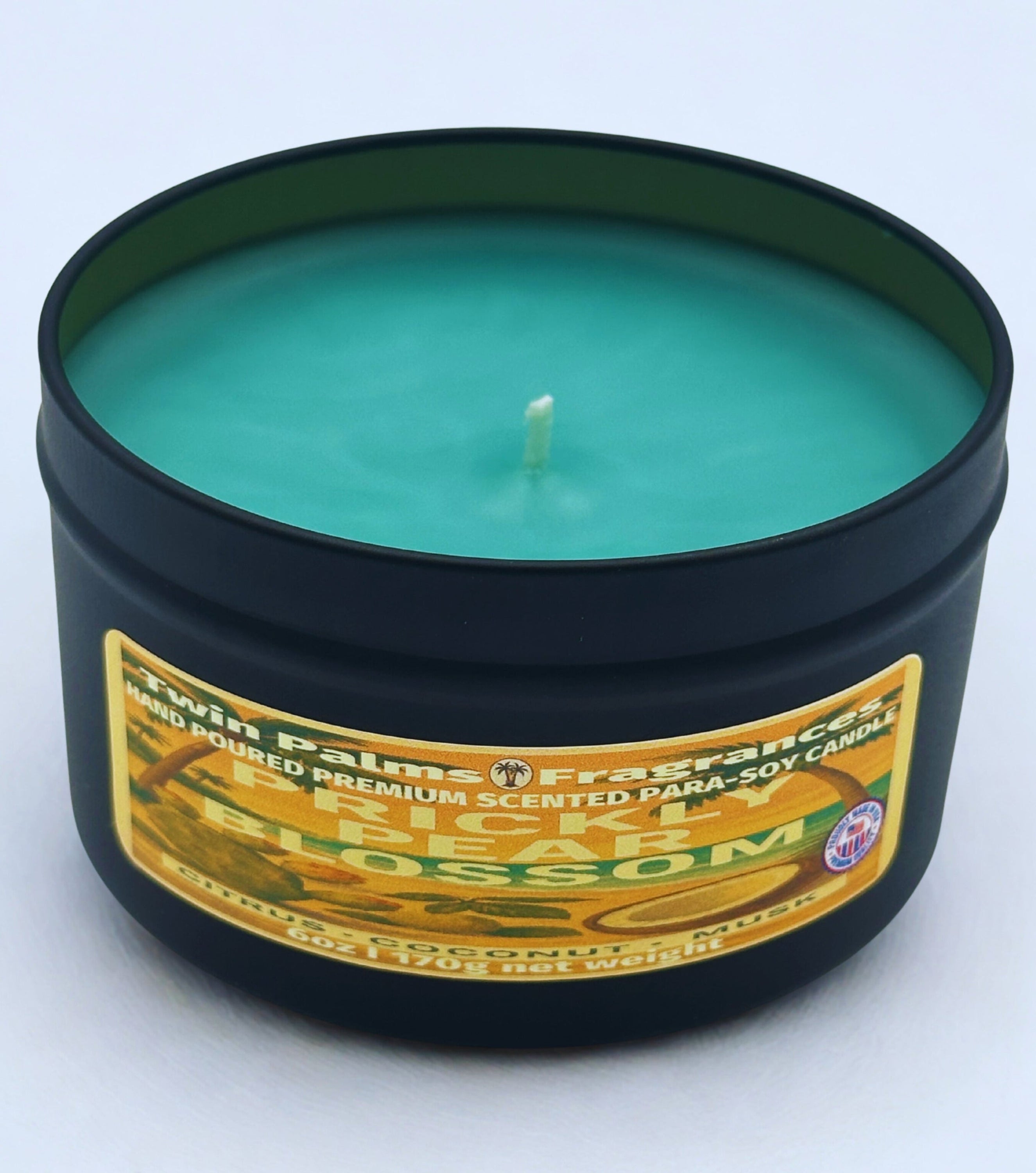 Twin Palms Fragrances candle Prickly Pear Blossom  in a tin with a label on a white background