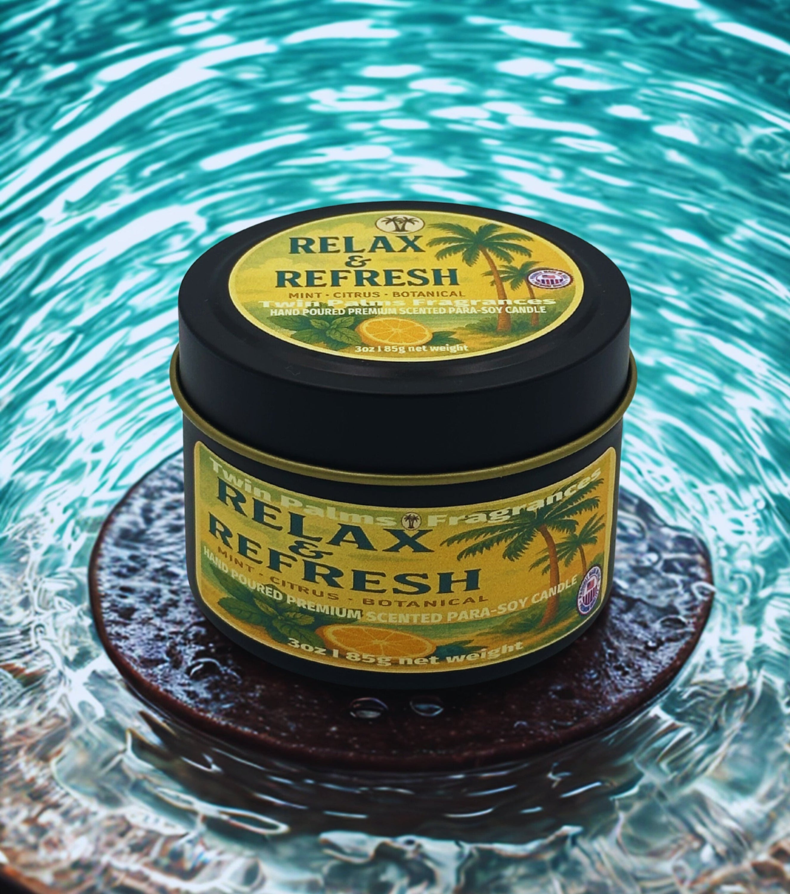 Tin of 'Relax & Refresh' candle on a reflective surface with water in the background