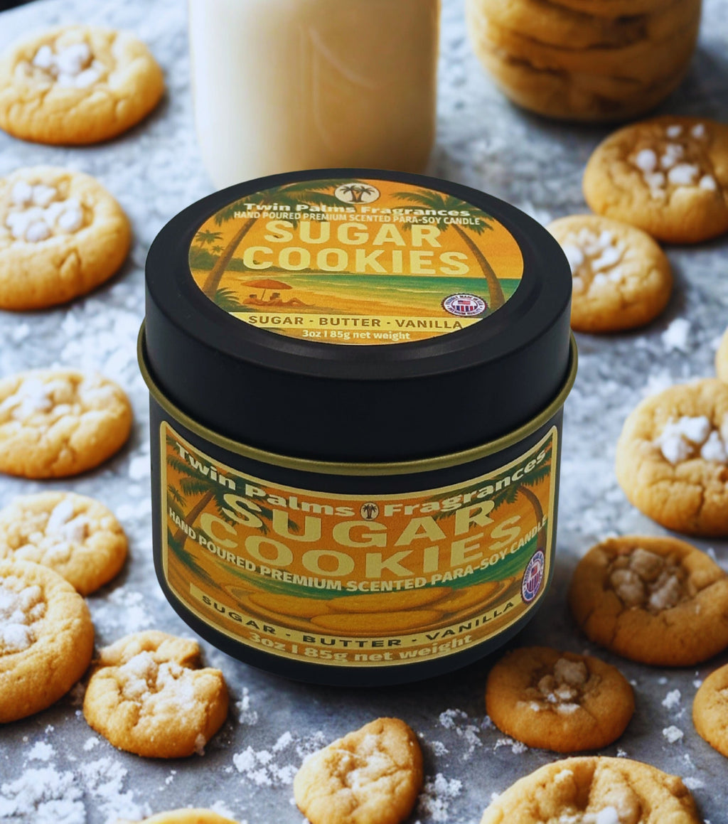 Twin Palms Fragrances Sugar Cookies candle surrounded by cookies on a textured surface