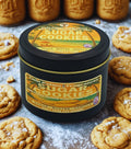 Twin Palms Fragrances Sugar Cookies candle surrounded by cookies on a textured surface