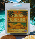 Pack of Twin Palms Fragrances Sugar Cookies scented soy wax melts with a tropical background.