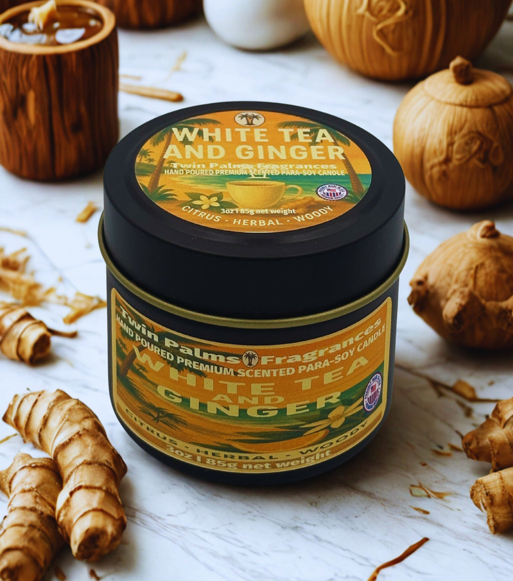 Tin of 'White Tea and Ginger' candle with ginger roots and pumpkins on a white surface